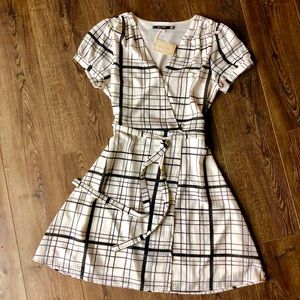 Black and white Doe & Rae faux wrap dress